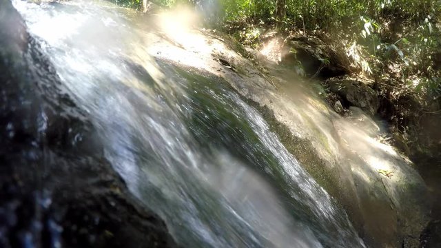 Close-up video footage of a small waterfall in a protected area of Brazil.