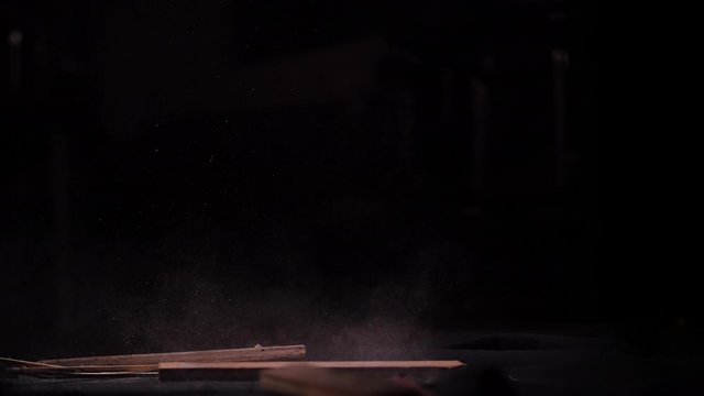 Old Dusty Scrap Wood Falling on the Ground in Black Studio (Shot 2 of 2)