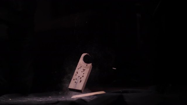 Old Dusty Scrap Wood Falling on the Ground in Black Studio (Shot 1 of 2)