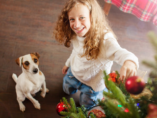 Child with dog decoration christmas tree