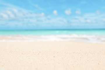 Fototapeta na wymiar Sand, sky, sea summer concept with defocused background