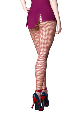 Long slender sexy legs woman short skirt stockings.