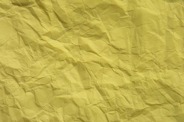 Yellow creased paper texture background