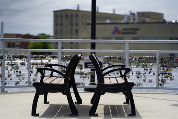 Many Locks locked up on a wired fence at De Pere, Wisconsin Dam symbolize the love of a relationship.