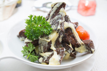Beer snack of bread toast with garlic, cheese and sauce