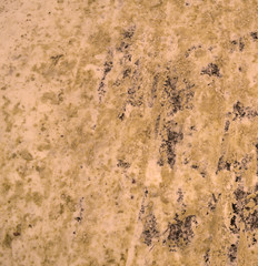 Orange dirty snow background. The texture of the road.