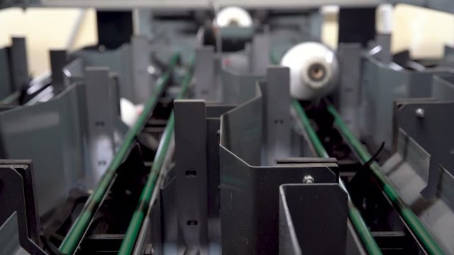 Bowling machine at play, prepares and puts pins on the pindeck for players