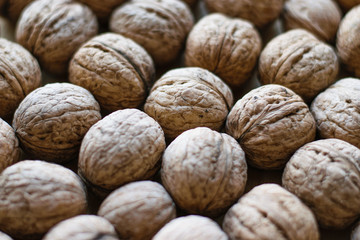 walnuts on wooden background. For articles about the garden, autumn harvest.