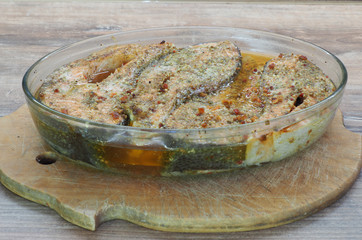 baked trout steak in a glass oval bowl