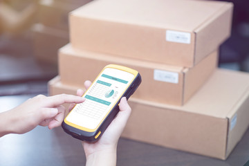 hand holding portable barcode scanner