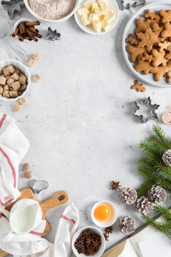 Christmas or Xmas baking culinary background. Ingredients for cooking on kitchen table. New Year or Noel holiday festive decorations, copy space