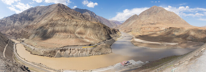 Panorama confluence of the Indus and Zanskar Rivers , brown water in summer, is located in Ladakh,...