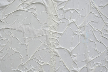Paper glued to the wall close-up. Abstract background for designers.