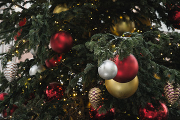 Details decorated Christmas kiosk with red, golden balls, garland. Outdoor fair. Xmas pattern....