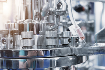 Chemical reactor. Clean pharmaceutical equipment, lots of sparkling chrome plumbing.
