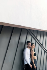 Sports. Woman at the gym doing stretching exercises and smiling on the floor