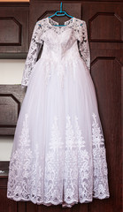 Fototapeta na wymiar White wedding dress of the bride