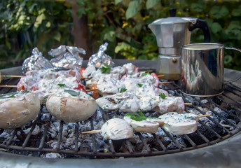 homemade kebabs of chicken, mushrooms and tomatoes