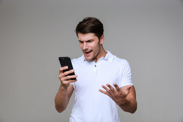 Emotional young man posing isolated