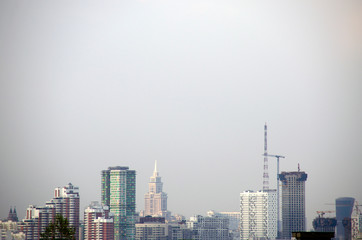 Urban landscape. Skyscrapers, high-rises, cranes against the sky. The growing metropolis of Moscow, Russia.