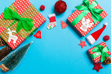 Top view of Christmas decorations on blue background. New Year holiday concept with copy space