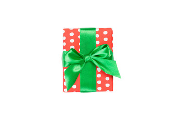 Christmas or other holiday handmade present in red paper with Green ribbon. Isolated on white background, top view. thanksgiving Gift box concept