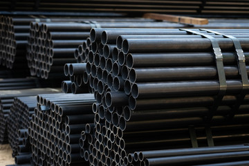Black steel pipe bundles at the construction site