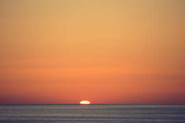 The sun rises over the sea, dawn in Sicily