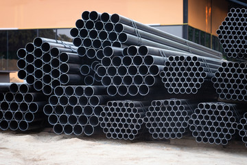 Black steel pipe bundles at the construction site