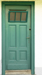old wooden green door in austria