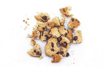 Cookies chocolate broken into pieces on white background.