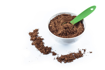 tasty cocoa powder in bowl top view on white background.