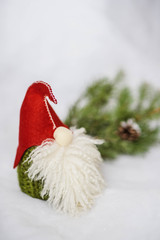 a toy. Christmas Scandinavian gnome in a red hat with a beard