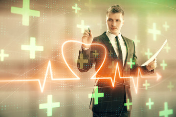 Man and heart drawing hologram. Double exposure. Concept of medical education