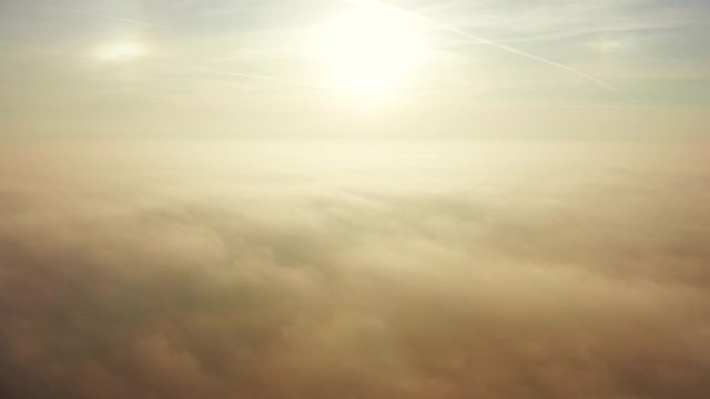 Aerial view of the landmark of the bridge in the fog in Warsaw. Drone flies above the clouds of fog and the Vistula river at sunrise. Spectacular Sunrise with low fog. bridge Siekierkowski, Warsaw.
