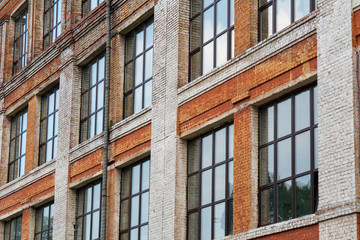 Fototapeta na wymiar brick old building with windows