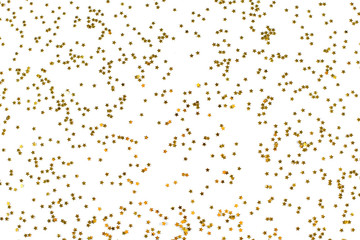 Golden little stars glitter confetti on gray background. Christmas festive New Year 2020 background
