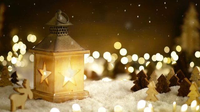 Christmas scene in warm lantern light and snowfall