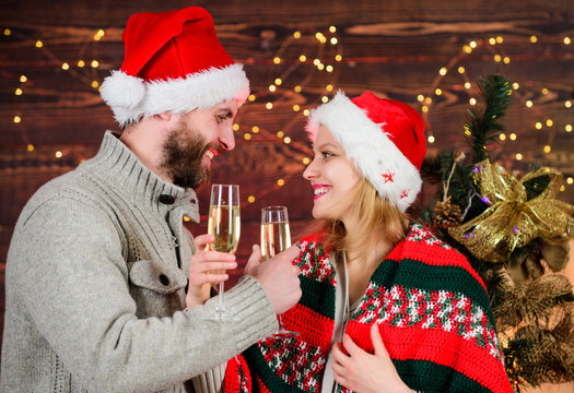 Real happiness. merry christmas. Family drink champagne. woman and man love xmas. happy new year. Holiday celebration. couple in love santa hat. Time for presents. greeting time. Couple feeling cozy
