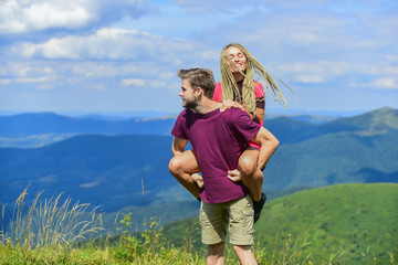 Beautiful couple embracing landscape background. Journey to mountains concept. Honeymoon in highlands. Two hearts full of love. Couple in love summer vacation. Love and trust. Romantic relations