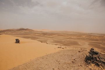 Fototapeta na wymiar Moroccan desert landscape with dunes and arid terrain.