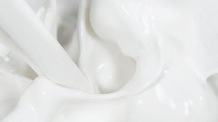 Macro shot of pouring cream in detail