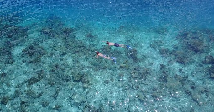 Snorkelers in a Clear ocean lagoon, Indonesia