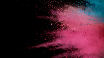 Explosion of colored powder isolated on black background
