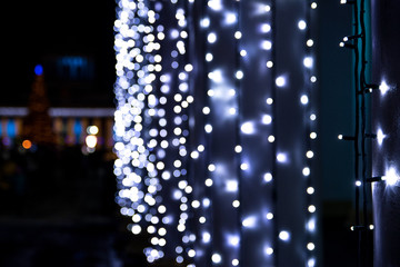 New Year lights abstract photo. Blurred lights on background. Christmas garland