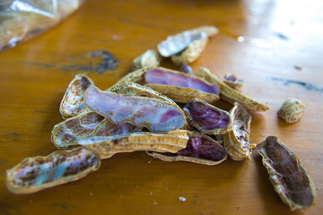 a peel of boiled peanuts on wooden table Thai healthy food peanut corn boil .