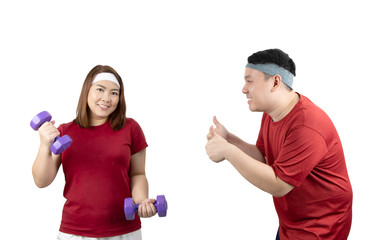 Portrait of happy young overweight Asian couple smiling and exercising with dumbbells together isolated on white background with copy space. Healthy lifestyle, body shape and sport concept.