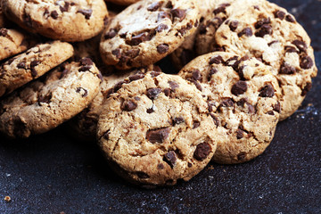 Chocolate cookies on wooden table. Chocolate chip cookies shot on table