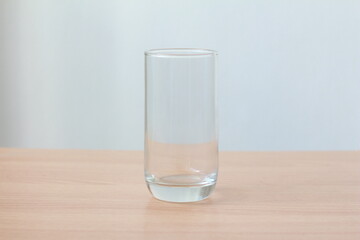 Empty glass on wood table.