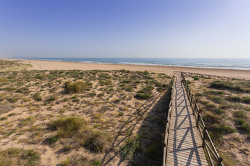 Footbridge on the sand dunes in the Mediterranean, spain